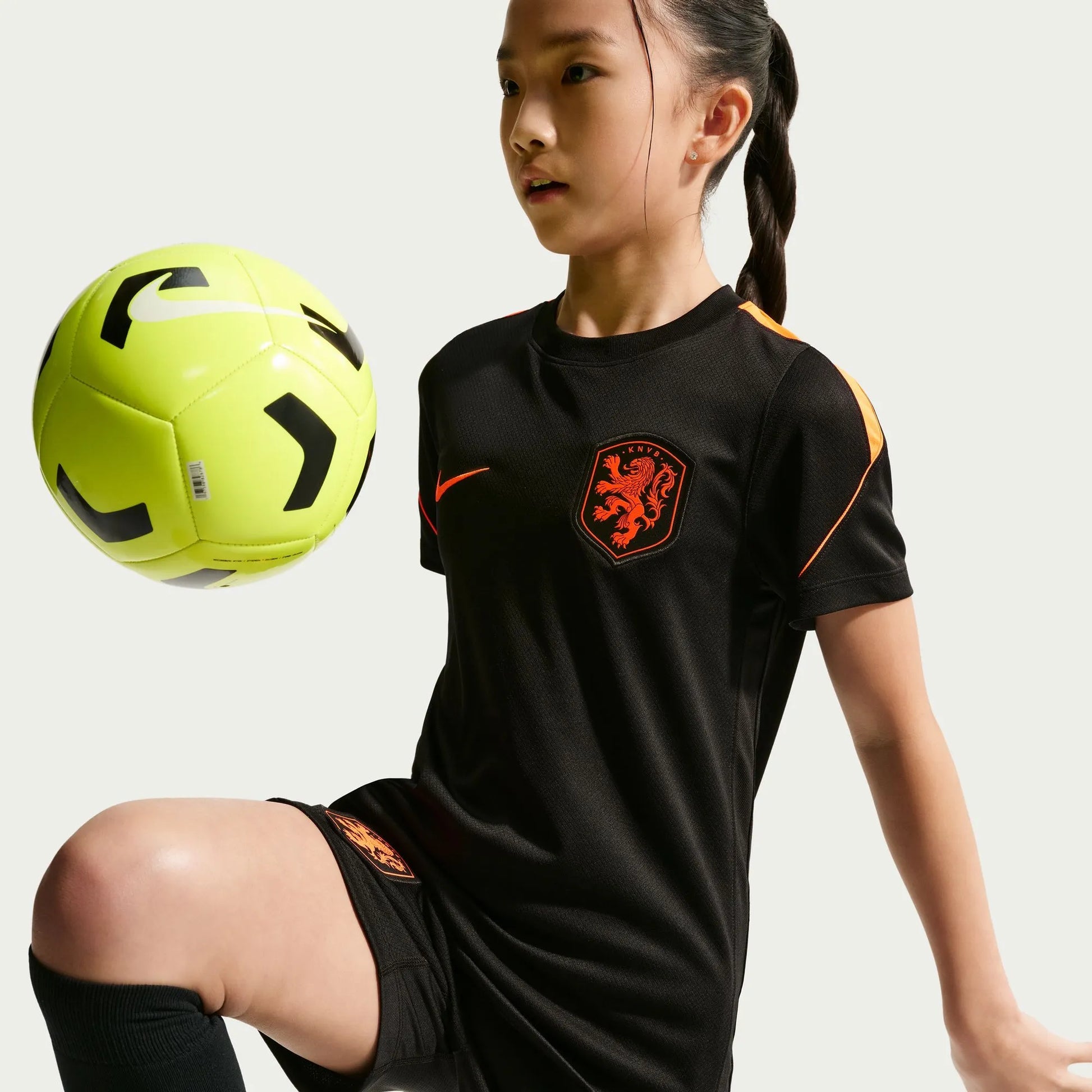 2026-27 Netherlands Youth Strike Top Black/Hyper Crimson/Hyper Crimson